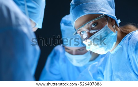 Team surgeon at work on operating in hospital Royalty-Free Stock Photo #526407886