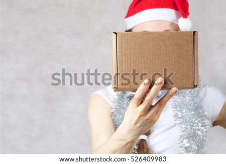 Young lady in a Santas hat. Free space for a text.