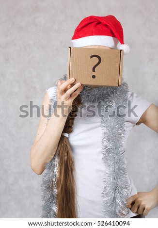 Young lady in a Santas hat. Free space for a text.