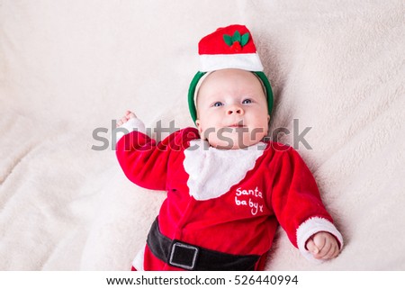 Beautiful little baby celebrates Christmas