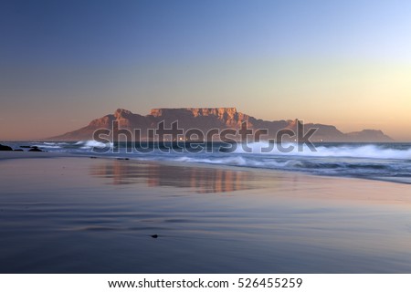 view of table mountain from bloubergstrand in  cape town south africa Royalty-Free Stock Photo #526455259
