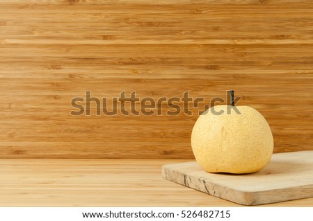 Pear on wooden table.