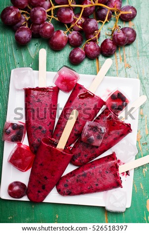 Homemade blueberry and grape  ice cream on a stick