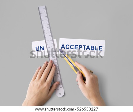 Unacceptable Unwelcome Hand Cut Word Split Concept Royalty-Free Stock Photo #526550227
