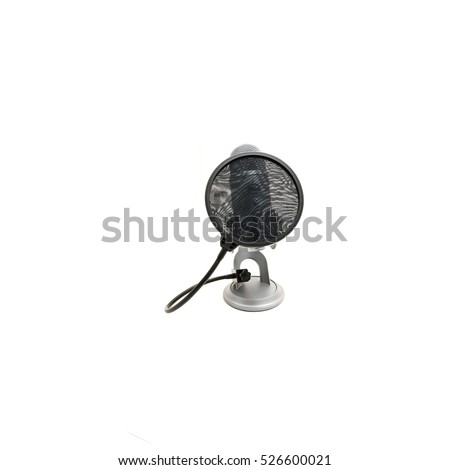 Close up pop filter attached to microphone isolated on white background. Modern space grey USB microphone with recording control buttons for podcast, broadcasting or voice over works.