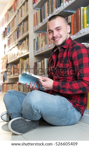 student preparing exam and learning lessons in school library, making research