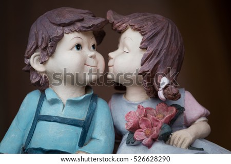 two lover dolls, girl  kissing boy