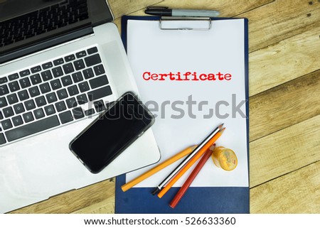 Word in notepad with wooden background, texture and notebookin a table. 