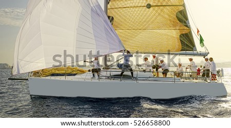 Luxury yachts at Sailing regatta. Sailing in the wind through the waves at the Sea. Royalty-Free Stock Photo #526658800