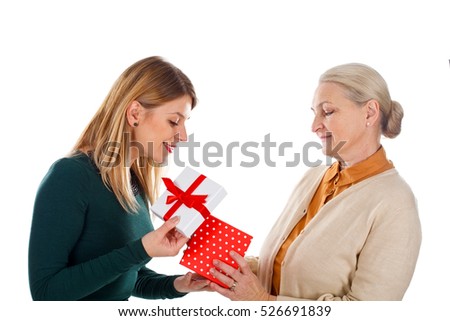 Picture of a beautiful young girl spending Christmas-time with her mother