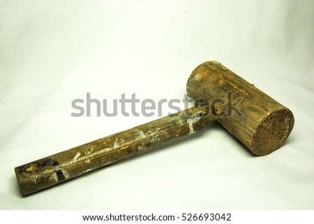 Old wooden hammer with paint