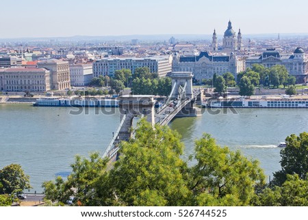 Banks of Donau and Szecheny lanchid in the Hungary, Budapest / Banks of Donau and Szecheny lanchid ( Orszaghaz ) Royalty-Free Stock Photo #526744525
