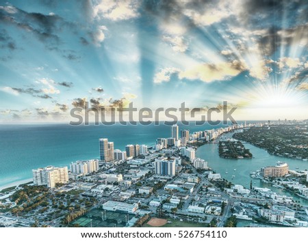 Miami Beach buildings and canals, aerial sunset view.