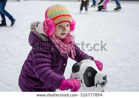 lovely little kid learnign to ice skate