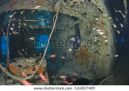 Diver penetrating the SS Thistlegorm shipwreck near Ras Muhammed, Red Sea, Egypt. Royalty-Free Stock Photo #526807489