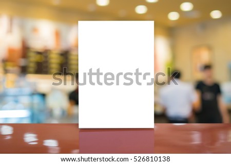Mock up Menu frame on Table in Bar restaurant-cafeteria,Stand for booklets with white sheets of paper acrylic  tent card,can be used for montage or display  