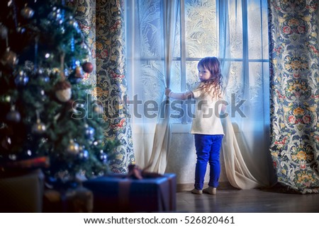 Little girl awaiting Santa Claus 