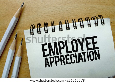 Employee Appreciation text written on a notebook with pencils Royalty-Free Stock Photo #526863379