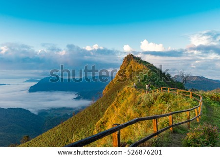 Sunrise at travel attractions Phu chee dao peak of mountain in Chiang rai,Thailand Royalty-Free Stock Photo #526876201