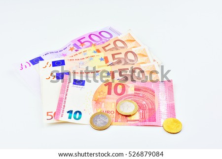 Money, banknotes and euro coins on white background