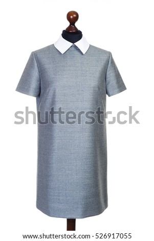 Woman grey classical short dress cloth on mannequin on white background, isolated Royalty-Free Stock Photo #526917055