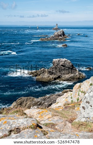 Coast in Brittany, with cliffs at the top of cliffs, Rocky promontory Pointe du Raz Royalty-Free Stock Photo #526947478