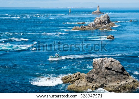 Coast in Brittany, with cliffs at the top of cliffs, Rocky promontory Pointe du Raz Royalty-Free Stock Photo #526947571