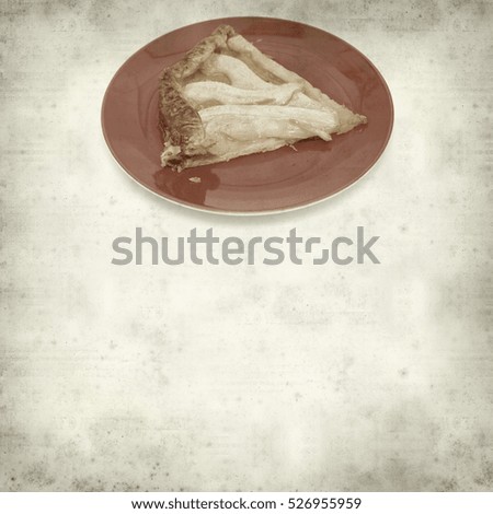 textured old paper background with pear cake slice