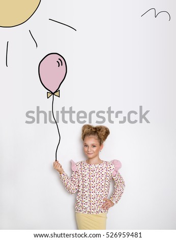 Happy funny child girl with a cartoon balloons isolated on white background. Cartoons drawing balloons concept. Little Girl with balloons.
