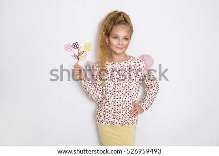 Happy funny child girl with a cartoon balloons isolated on white background. Cartoons drawing balloons concept. Little Girl with balloons.