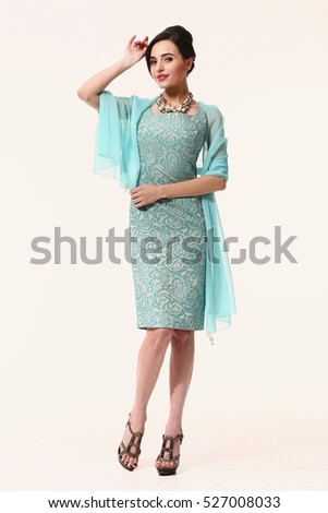 indian asian eastern brunette business executive woman with updo hair style in party coctail  dress blue with kerchief high heels shoes full length body portrait standing isolated on white