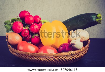 Vintage photo of fresh ecological vegetables in the basket