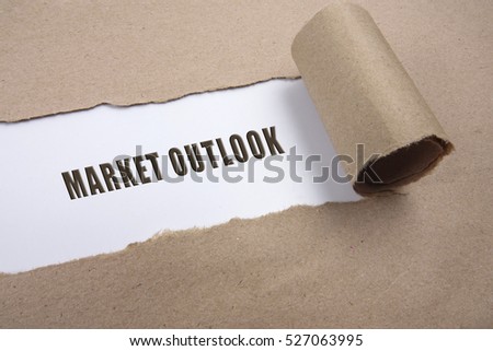 Torn brown paper on white surface with "market outlook" word. Business concept