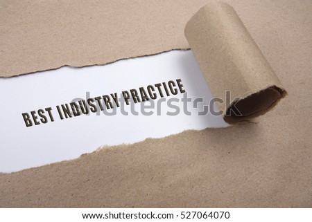 Torn brown paper on white surface with "best industry practice" word. Business concept