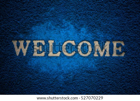 Gold Welcome character on old blue mat, 
dark matted background & textured : Your text design & copy space

