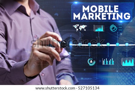 Technology, internet, business and marketing. Young business man writing word: Mobile marketing