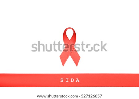 red ribbon with words AIDS, HIV, SIDA on white isolated background