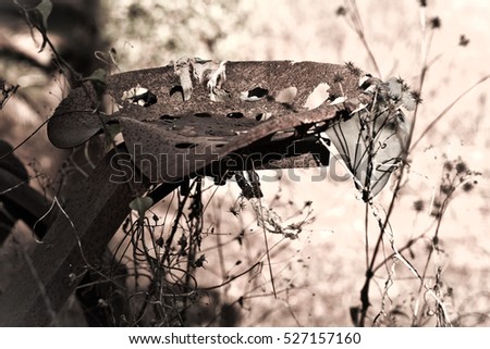 Old rusted farm tractor seat