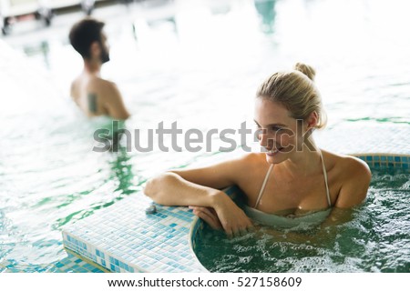 Beautiful woman in resort spa  swimming pool