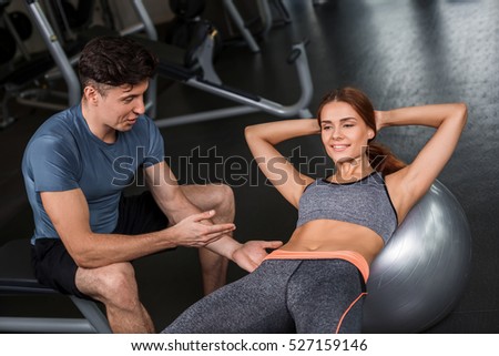 happy cutie athletic girl , execute exercise in sport-hall