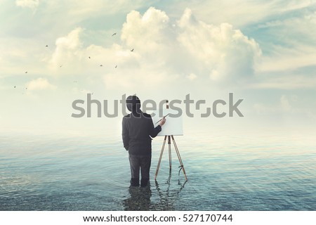 fantastic creative painter with easel drawing on canvas  Royalty-Free Stock Photo #527170744