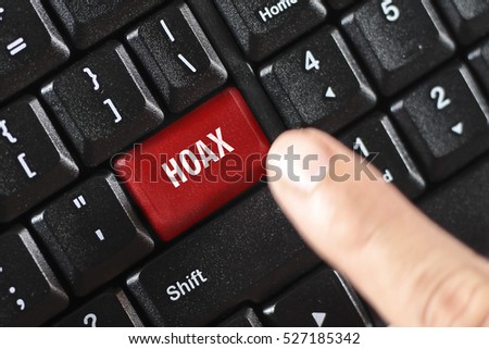 hoax word on red keyboard button Royalty-Free Stock Photo #527185342