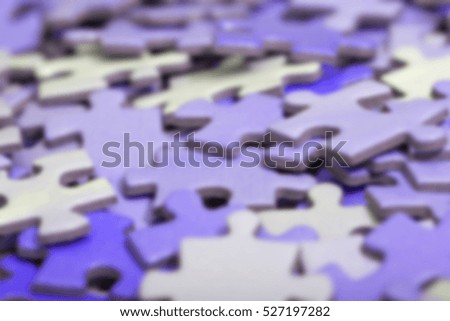 Purple puzzle pieces. Image has a slight blur effect added.