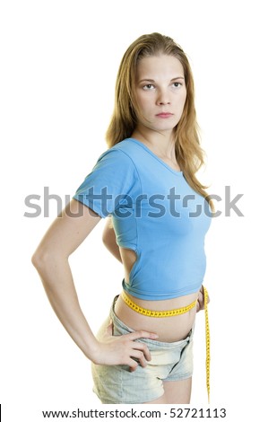Young  slender  woman measuring her waist with measure tape