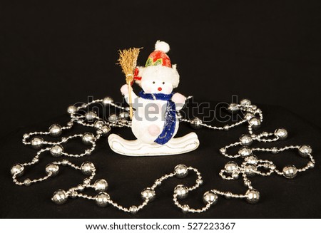 Little Snow man ,christmas decoration .ornaments ,white ,black  background ,funny ,cute ,doll ,happy ,thin ,