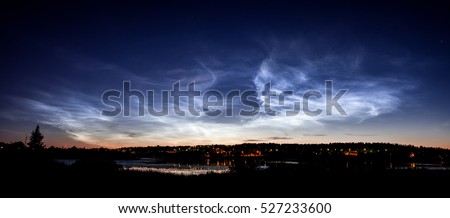 Noctilucent clouds at night sky Royalty-Free Stock Photo #527233600