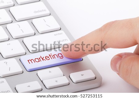 Marketing word written on computer keyboard.