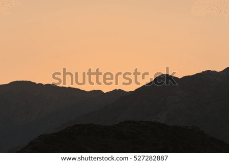 Sunset in a desert mountains