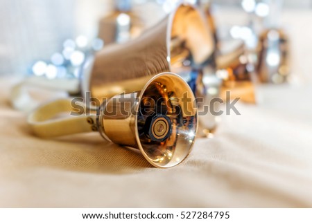 Golden handbells ready to play close up Royalty-Free Stock Photo #527284795