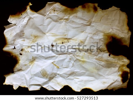 Old burned paper Royalty-Free Stock Photo #527293513